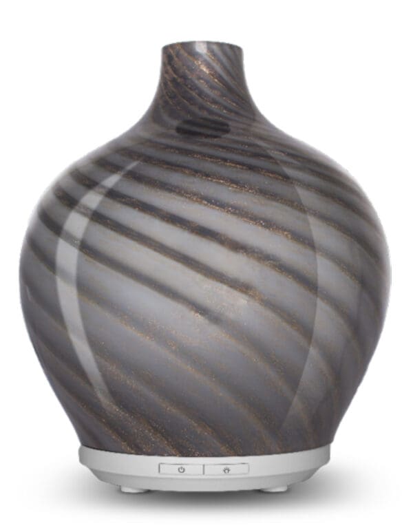 A gray vase with a spiral design on the bottom.