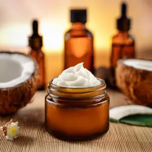 A jar of cream sitting on top of a table.