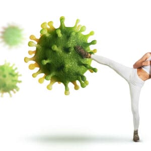 A person kicking around a green virus.