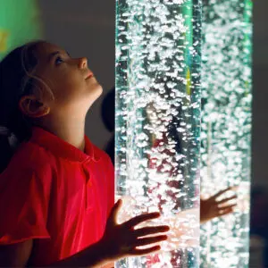 A young girl looking up at the sky