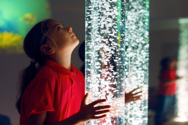 A young girl looking up at the sky