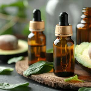 A close up of three bottles on top of a table