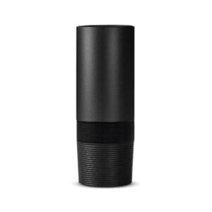 A black speaker is sitting on the floor