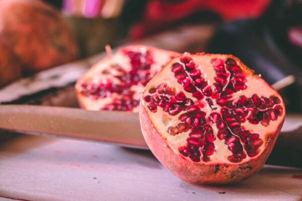 A close up of two pieces of fruit