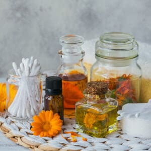 A table topped with jars of different kinds of oils.