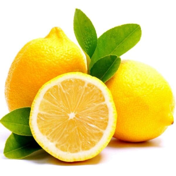 A close up of lemons with leaves on the table